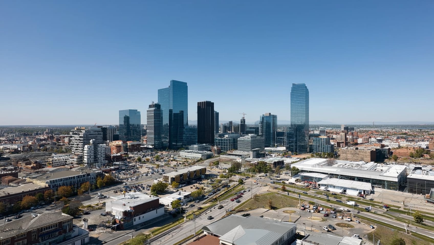 Wide view of a commercial district skyline spanning multiple asset types